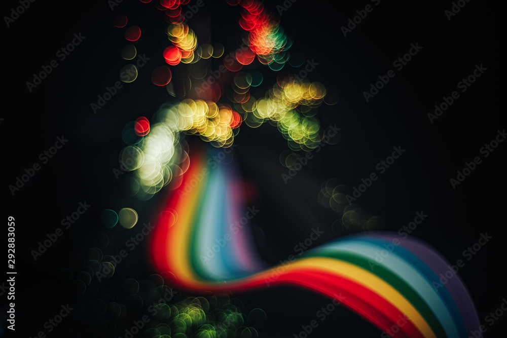 Poster beautiful abstract rainbow bridge and multi colored space background in the darkness.