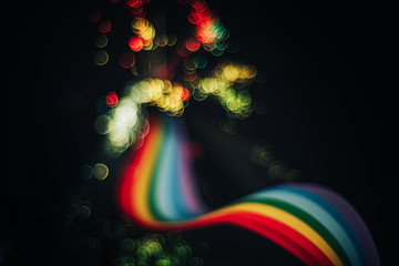 Beautiful abstract rainbow bridge and multi colored space background in the darkness.