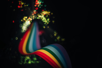Beautiful abstract rainbow bridge and multi colored space background in the darkness.