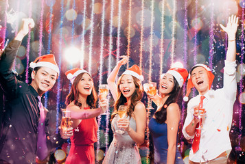 happy young group having fun in christmas party