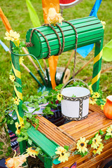 Fototapeta premium Water well with a white bucket in the village close up