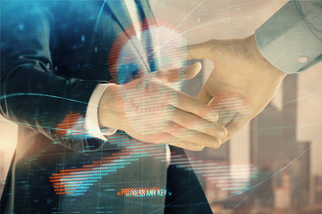 Multi exposure of digital crime theme hologram on city view background with two people handshake. Concept of securitization