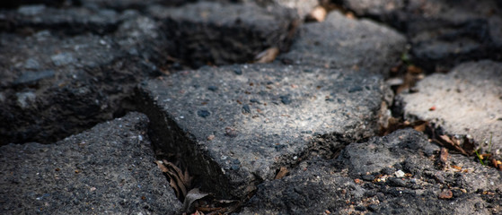 Background from pieces of damaged asphalt
