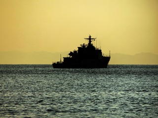 Fototapeta na wymiar Ship in the sea at sunset