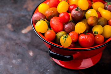 Cherry tomatoes. Summer useful vegetable for vegetarians. Variety of colors and tastes.