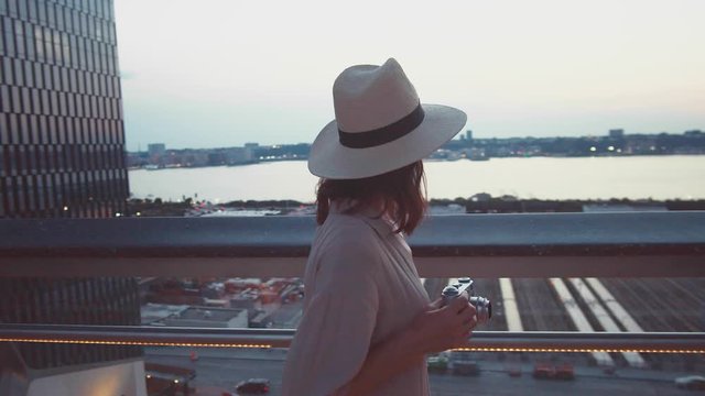 Young girl with a retro camera in the Wessel building in New York City