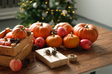 Gift boxes with pumpkins garlands holiday concept.