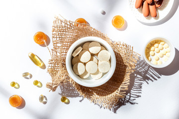 Nutritional supplements and vitamins on white background. Medicines for health support. Pills and supplements for people health.