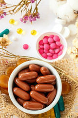 Nutritional supplements and vitamins on white background. Medicines for health support. Pills and supplements for people health.