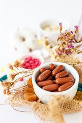 Nutritional supplements and vitamins on white background. Medicines for health support. Pills and supplements for people health.