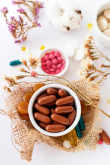 Nutritional supplements and vitamins on white background. Medicines for health support. Pills and supplements for people health.