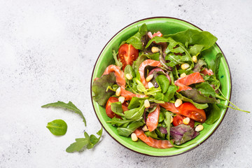 Salmon salad on white top view.