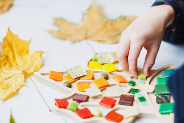 Wooden shape of trees with colored mosaic.