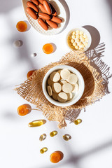 Nutritional supplements and vitamins on white background. Medicines for health support. Pills and supplements for people health.