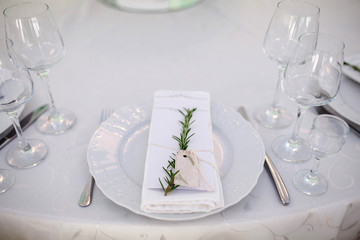 Table for brides decorated with live flowers and candles. Interior texture.