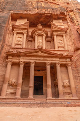 Al Khazneh. It is the treasury in Petra ancient city. Petra is the main attraction of Jordan. Petra is included in the UNESCO heritage list.