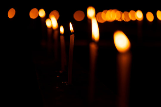 Beautiful Burning Candles Decoration On Diwali. Burning candles with shallow depth of field candlelight background image for diwali festive decoration or church celebration at night with copy space.