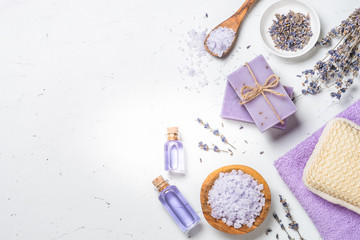Lavender cosmetics on white top view.