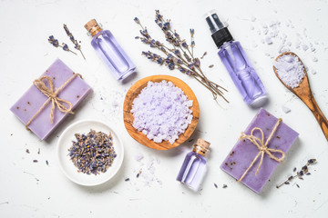 Lavender cosmetics on white top view.