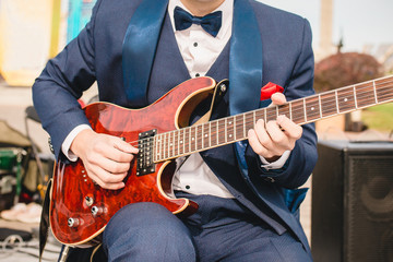 Variety Orchestra Guitarist with Red Electric Guitar