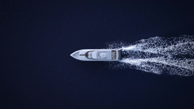 The yacht takes a walk near the islands. Beautiful sunny sunset. 3d render. 4k video