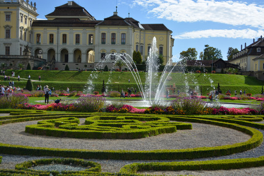 Water fountain with baroque garden in the background