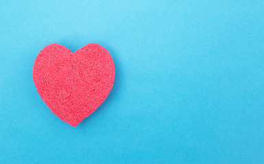 Red heart on a blue background. Concept of human heart disease and heart bypass surgery. Myocardial...