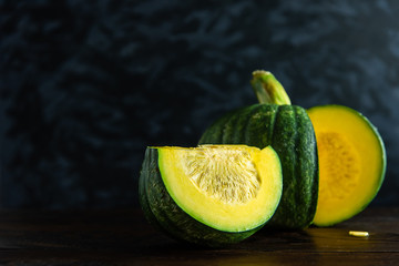 Still Life of Pumpkin on dark background and black wall