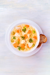 Chicken noodle soup, shot from the top with a place for text