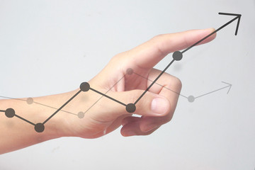 Hand touching  graphs of financial indicator and accounting market economy analysis chart