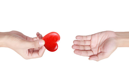 Hands holding  red heart, heart health, and donation concepts...