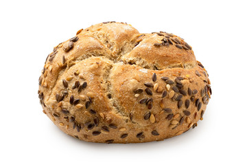 Traditional whole wheat kaiser roll with linseeds and sesame seeds isolated on white.