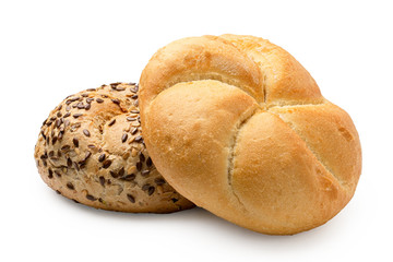 Plain kaiser roll on top of whole wheat kaiser roll with seeds isolated on white.