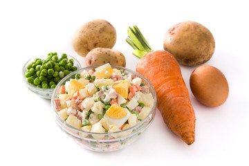 Traditional Russian salad in bowl. Olivier salad isolated on white background