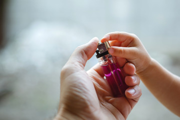 Close up hands of a man with lighter in his hands.