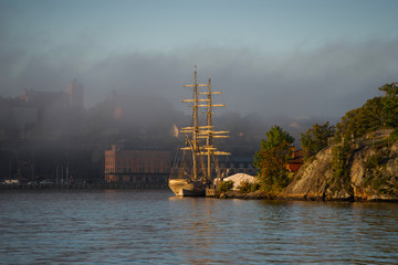 Morning view over Stockholm inner harbour with boats, canoes, piers and islands an autumn day