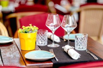 Fototapeta na wymiar Glasses table setting in a summer restaurant