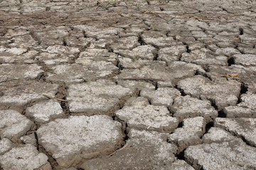 Dry lake bed with natural texture of cracked clay in perspective floor