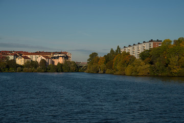 Morning view over Stockholm inner harbour with boats, canoes, piers and islands an autumn day