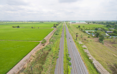 aerial view from flying drone of railroad tracks, train