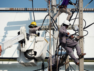 electrician man working at height and dangerous ,high voltage power line maintenance