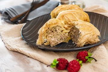 Blanched cabbage leaves surrounding a pork and turkey preparation and soy protein