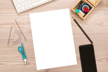 Paper, pencil, ruler, smart phone on wooden desk