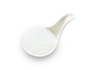 White pure cane sugar in white spoon.