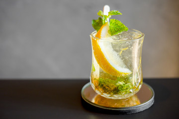 Cocktail mojito with lime slic in glass.