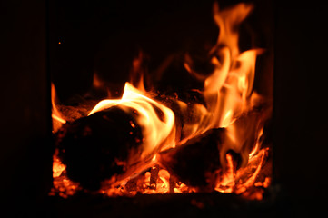 blurred burning coals in the stove