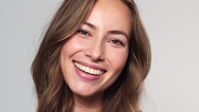 Woman with Brown Eyes Smiling at the Camera