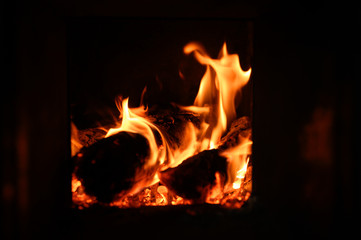 Obraz premium blurred burning coals in the stove