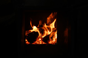 blurred burning coals in the stove