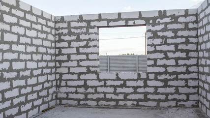 Fototapeta na wymiar New construction of a one-story building from a foam block in Ukraine. Window